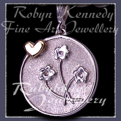 14 Karat Yellow Gold and Sterling Silver 'Heart & Flowers' Charm Image