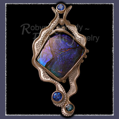 Pendant / Brooch featuring a Genuine Alberta Freeform Ammolite and Diffused Topaz Gemstones set in Sterling Silver and 10 Karat Yelllow Gold