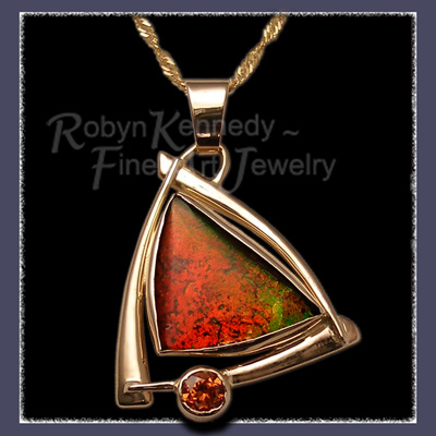Genuine Ammolite Gemstone Pendant constructed in 14 Karat Yellow Gold and accented by a vibrant Mandarin Garnet