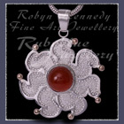 10 Karat Yellow Gold, Sterling Silver and Carnelian 'Sun' Pendant Image