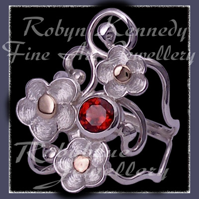 10 Karat Yellow Gold, Sterling Silver and Mozambique Garnet 'Feelin' Groovy' Ring Image