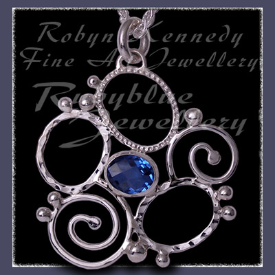 Sterling Silver and Glacier Blue Topaz 'Spring' Flower Pendant Image