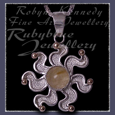 10 Karat Yellow Gold, Sterlling Silver and Rutilated Quartz 'Sun' Pendant Image
