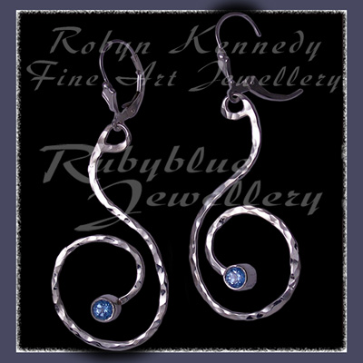 Sterling Silver and Ice Blue Topaz 'Swirls' Earrings Image